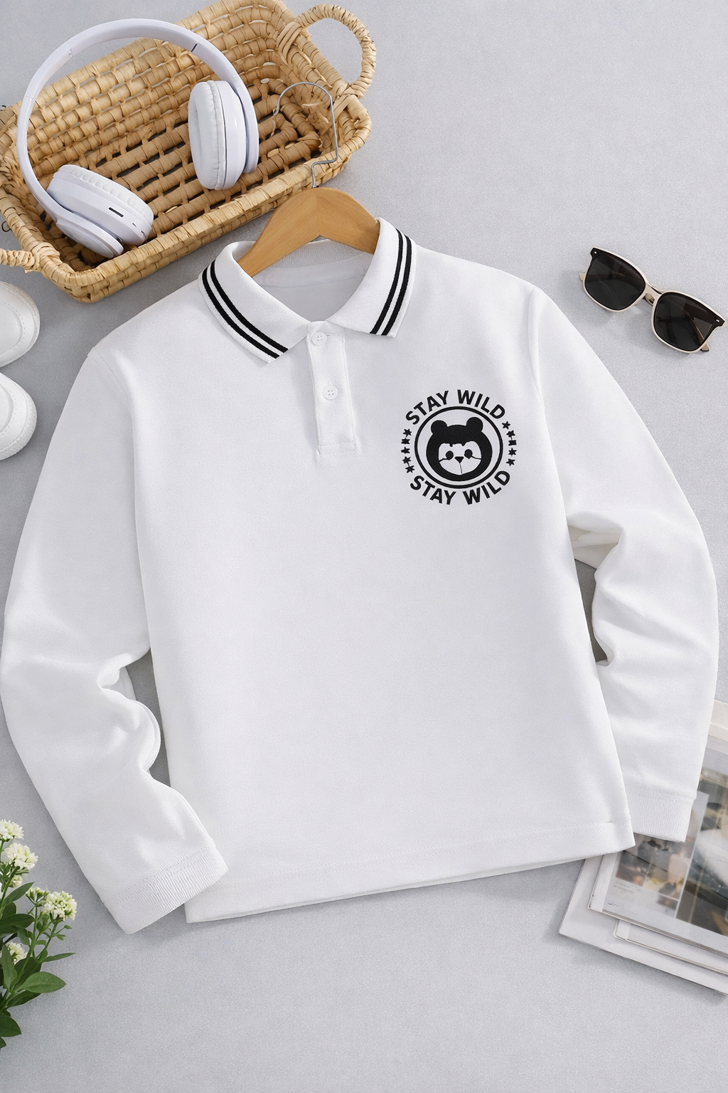 Kids’ White Long-Sleeve Polo Shirt with Black Tipped Collar – “Stay Wild” Bear Embroidered Chest Badge