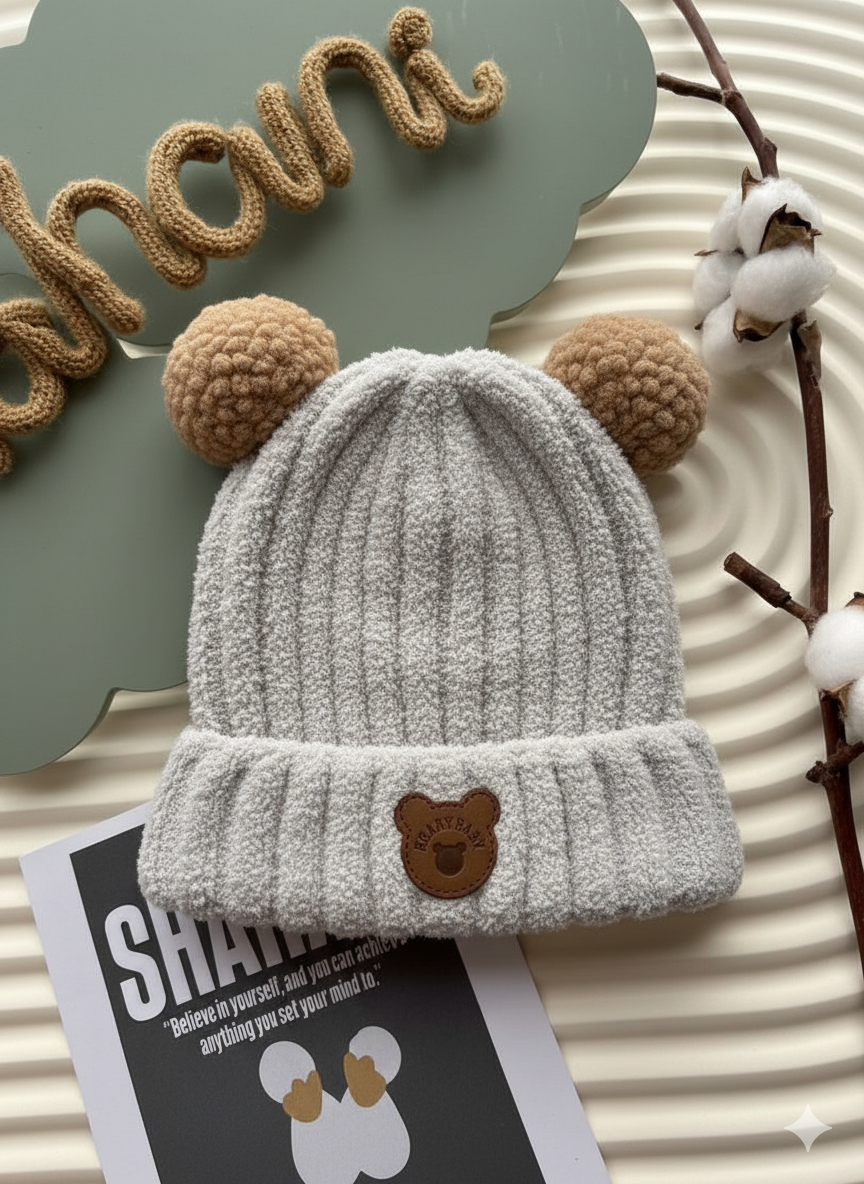 Children's knitted hat with pom poms. -S